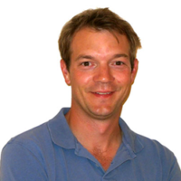 Man wearing a blue shirt against a white background