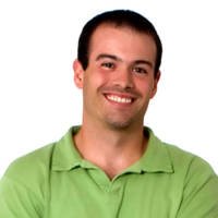Man wearing a green shirt against a white background